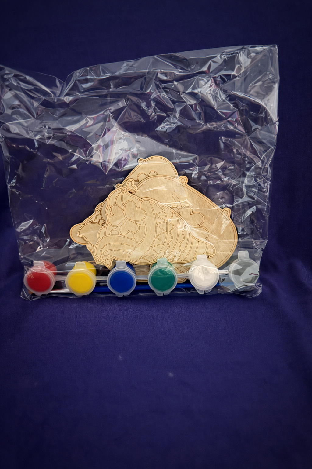 Plastic bag with gnome St Patrick's day wooden cut outs bundled with a paint set.